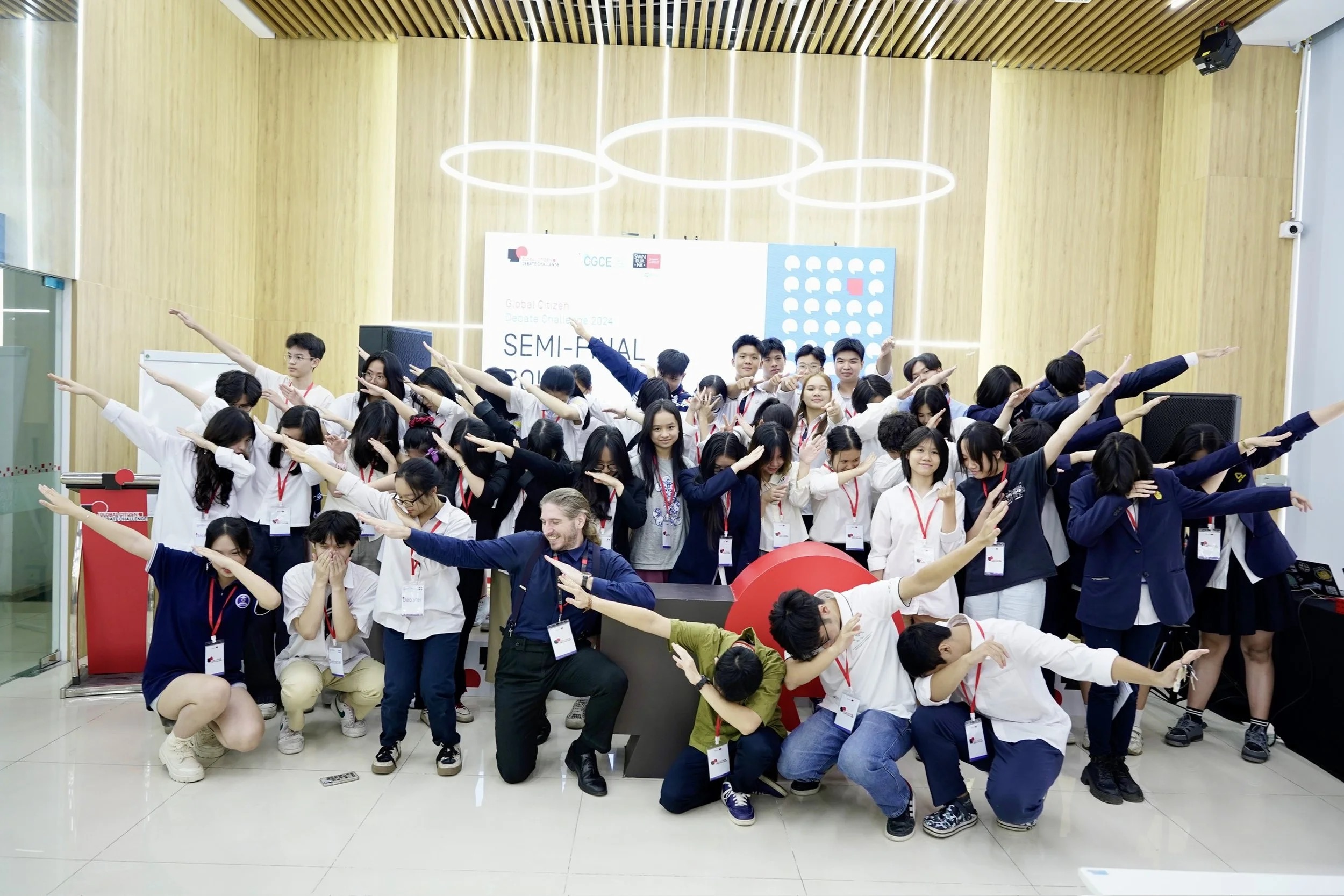 Students celebrating at the Global Citizen Debate semifinal