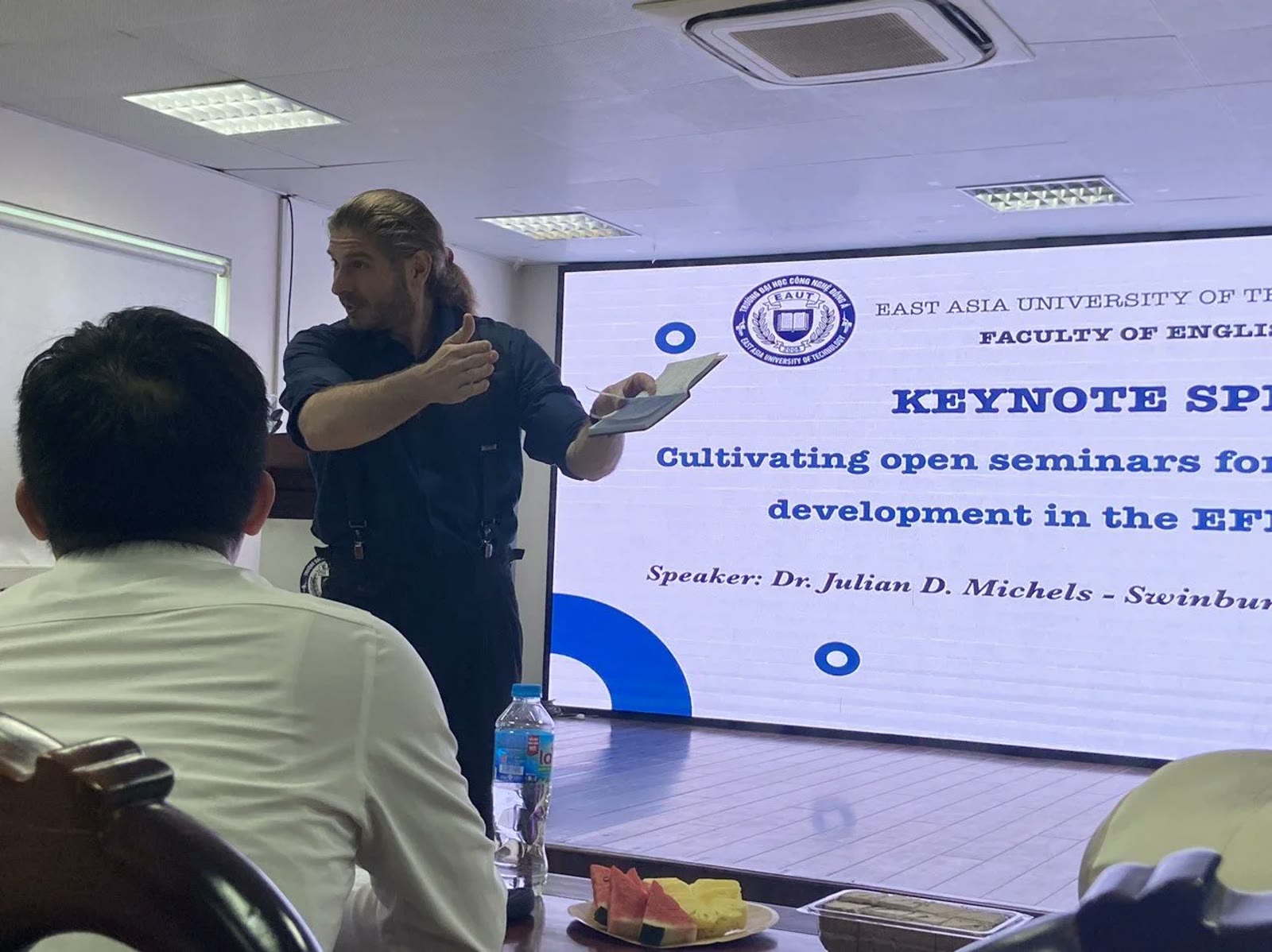 Dr. Julian delivering a keynote presentation on seminar-based learning